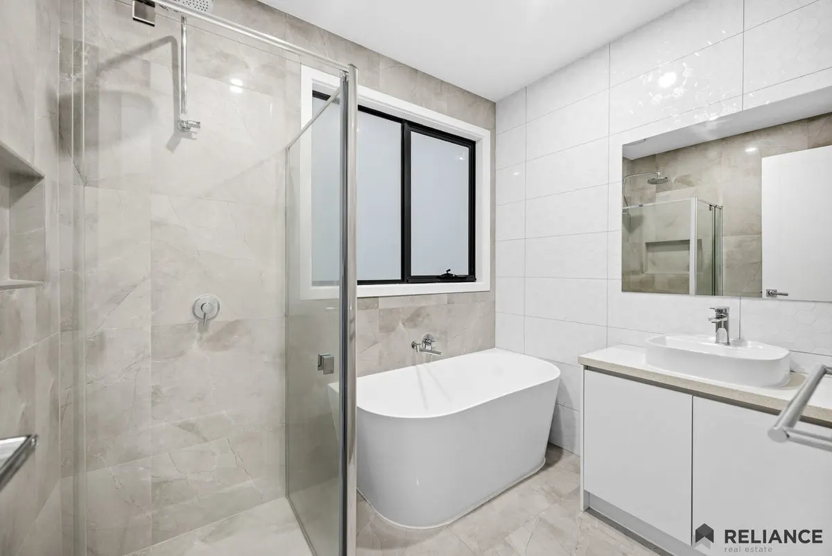 Second bathroom with a freestanding bath and separate shower at the Beveridge SIL home.