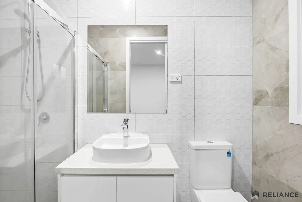 Bathroom with a shower and vanity in a modern home
